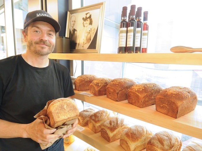  Larry’s Market's Ryan Dennis stocks shelves with sourdough bread from The Modern Pantry. Photo by Mike Wakefield/North Shore News