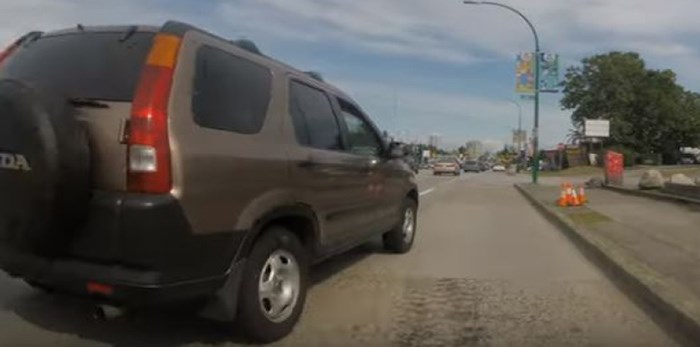  Look how close this driver got to a cyclist on Kingsway in Burnaby on Tuesday. Screenshot/Tristan Calvo