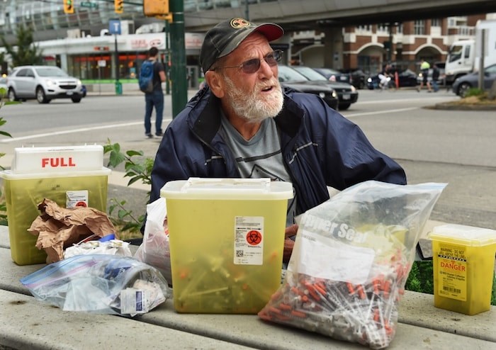  Charles Bafford, who lives in a modular housing building at Main and Terminal, spends his days picking up discarded needles in Vancouver. Photo by Dan Toulgoet/Vancouver Courier