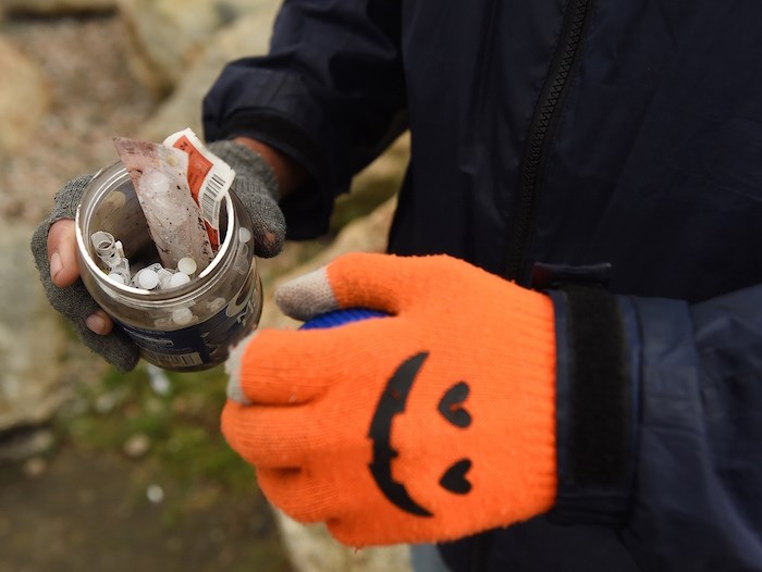  Charles Bafford uses a Maxwell House coffee jar to store the needles. Photo by Dan Toulgoet/Vancouver Courier