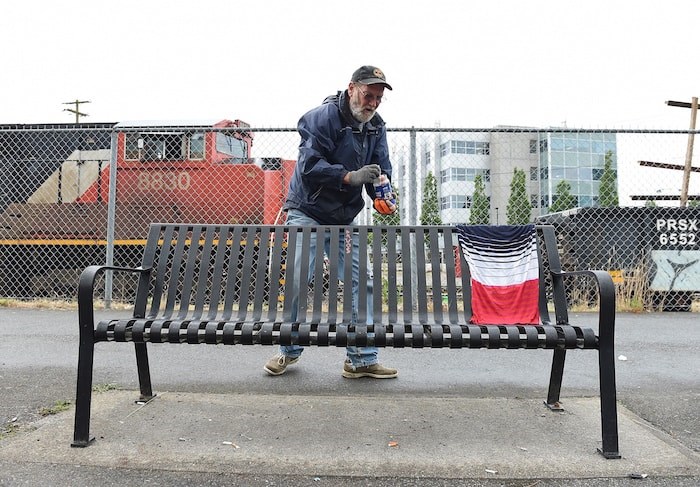  Charles Bafford picks up a discarded syringe on a path behind car dealerships on Terminal Avenue. Photo by Dan Toulgoet/Vancouver Courier