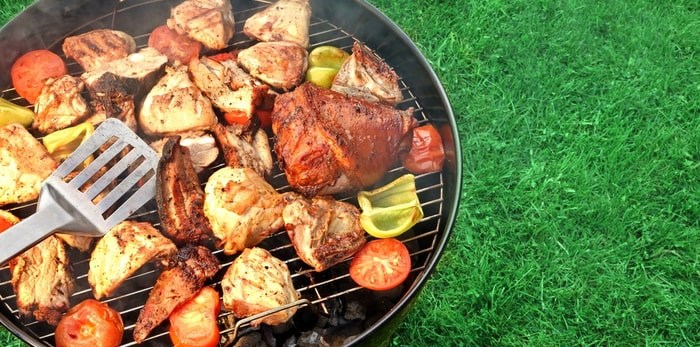  Grilling meat and veggies on a backyard BBQ grill/Shutterstock