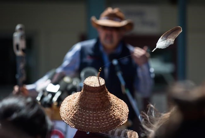  An eagle feather attached to a hat worn by Kwikwetlem First Nation Chief Ed Hall blows in the wind as Chief Joe Alphonse, back, Tribal Chair of the Tsilhqot'in National Government, speaks during a ceremony to commemorate the wrongful trial and hanging of Chief Ahan, in New Westminster, B.C., on Thursday July 18, 2019. Chief Ahan, who was hanged in the city on July 18, 1865, was one of six Tsilhqot'in First Nation chiefs who were executed following the Chilcotin War between the Tsilhqot'in people and European settlers. THE CANADIAN PRESS/Darryl Dyck