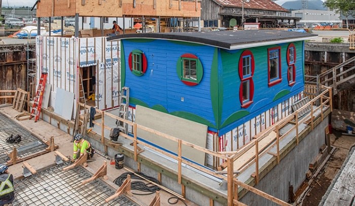  The Blue Cabin in dry dock with sustainable deckhouse under construction next to it.