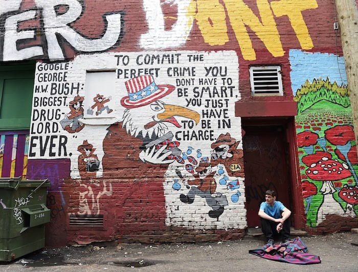  Messages mix with paint in this notorious Downtown Eastside alley. Photo by Dan Toulgoet/Vancouver Courier