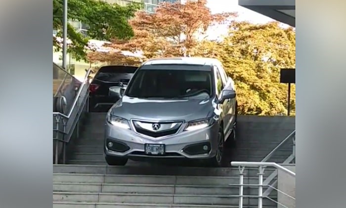  In a bizarre mishap, a woman has somehow managed to drive her SUV down a set of stairs at Sheraton Wall Centre. Photo: Ian Lampman