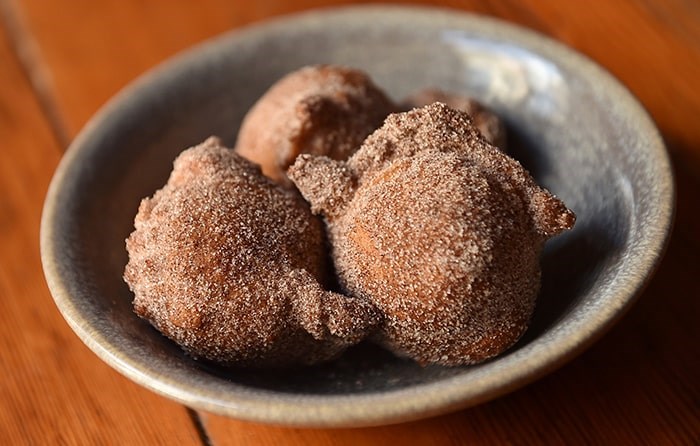  Ian McHale, executive chef of Wildebeest, infuses these delicious doughnuts with Twin Sails Con Leche Horchata Milk Stout for a light and fluffy texture. Photo Dan Toulgoet