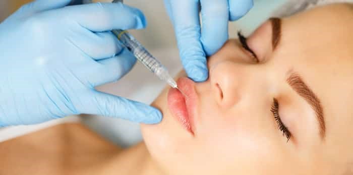 Photo: Injections of the lips. / Shutterstock