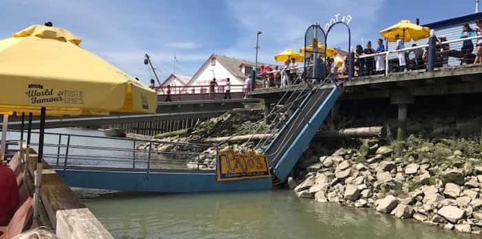  This photo of the collapsed walkway at Pajo's in July 2017 was taken by one of the people stranded on the floating dock. Photo: Twitter