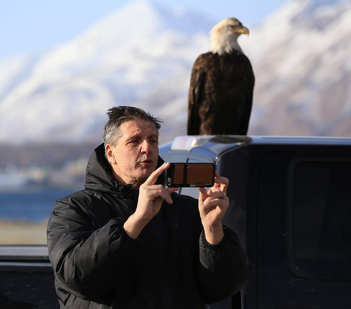  Christian Sasse stops to take a selfie with an eagle while out on a photo shoot. Photo: Sasse Photo Facebook