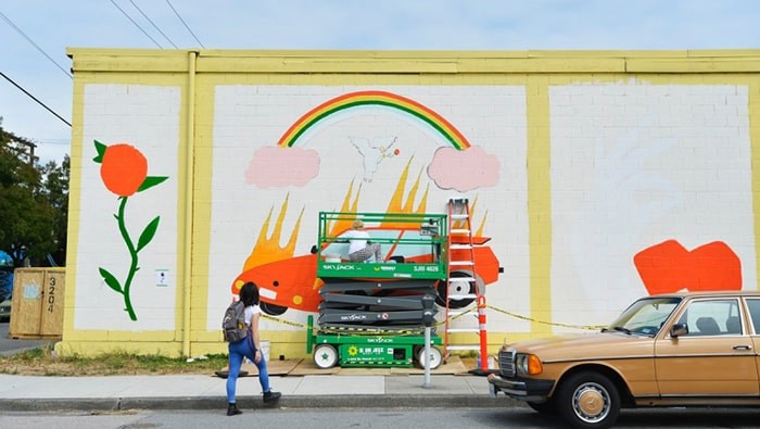  Alex Joukov works on her mural for Vancouver Mural Festival on East Fifth Avenue. This year's festival starts Thursday and will feature 25 new murals. photo Jennifer Gauthier