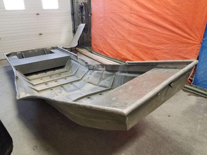  A damaged aluminum boat found in Manitoba has prompted the launch of an underwater search for B.C. fugitives. Photo courtesy Manitoba RCMP