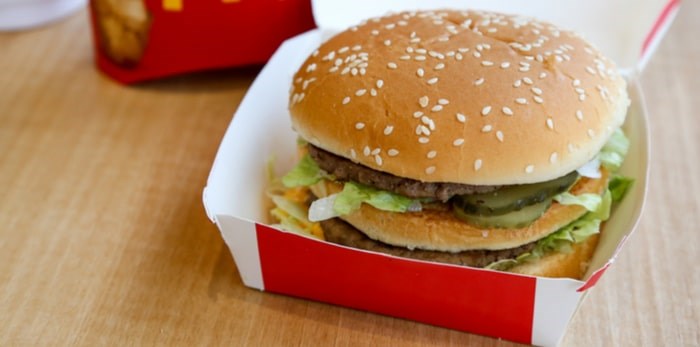  Two all-beef patties, special sauce, lettuce, cheese, pickles, onions, on a sesame seed bun. URAIWONS/Shutterstock.com