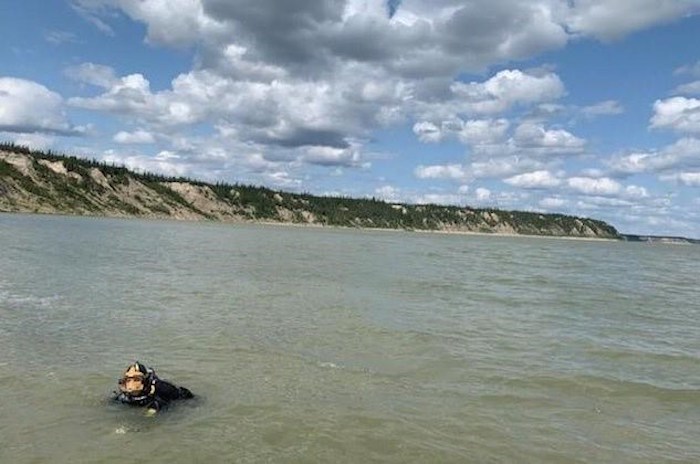  The RCMP Underwater Recovery Team completes their work following the discovery of a boat on the shore of the Nelson River, northeast of Gillam, Man. in this handout photo provided August 5, 2019. RCMP say they will no longer be searching a river in northern Manitoba for two murder suspects.THE CANADIAN PRESS/HO, RCMP