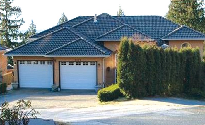  The Director of Civil Forfeiture has filed a lawsuit claiming this house at 2738 Chelsea Court was part of a money laundering scheme. The registered owner has denied those claims. Photo via BC Assessment