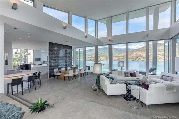  The great room has vaulted ceilings and massive windows to make the most of those epic lake views. Listing agent: Richard Deacon