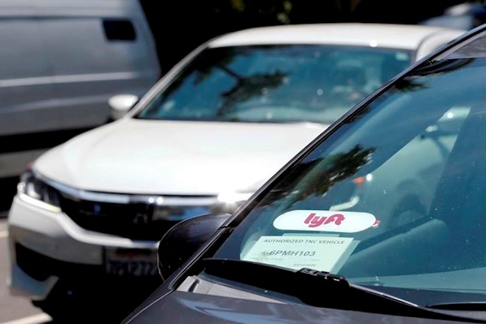  A Lyft ride-share car waits at a stoplight in Sacramento, Calif. on July 9, 2019. Ride-hailing company Lyft says it plans to be operating in Vancouver before the end of this year.The Passenger Transportation Board in B.C. has yet to unveil its final regulations for ride-hailing companies, but a statement from Lyft says the company is confident operations will begin in the Lower Mainland sometime this fall. THE CANADIAN PRESS/AP, Rich Pedroncelli