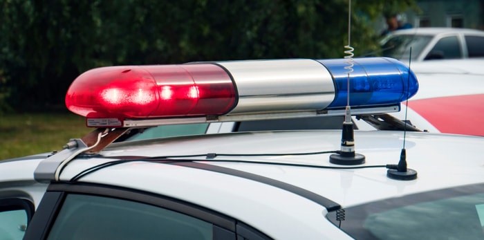  North Vancouver RCMP arrested a teen this month who has since been charged in connection with an alleged carjacking near UBC in Vancouver. Photo: Police lights/Shutterstock