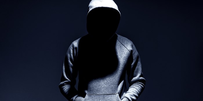  Unknown man in hoodie/Shutterstock