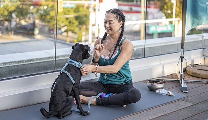  YYOGA instructor Hillary Keegan with a puppy. Photo: Talk Shop