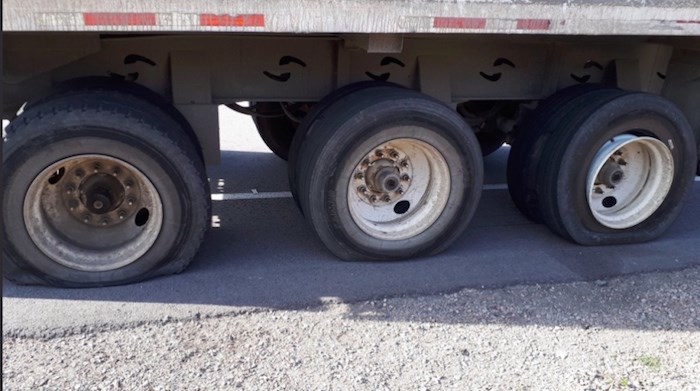  The Delta police traffic unit pulled over a truck Tuesday morning with six flat tires and a cracked tire rim. Photo courtesy Delta Police Traffic Division