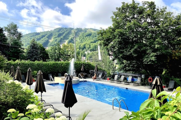  The hills of the Bromont ski area are seen from the pool area at Chateau Bromont in Quebec's Eastern Townships. Photo by Lindsay William-Ross/Vancouver Is Awesome