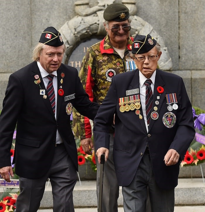  Bing Wong lays a wreath at the 2016 Aboriginal Veterans Day event at Victory Square. Photo by Dan Toulgoet
