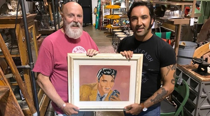  Dragonfly employee Bob Saunders (left) purchased a painting made by Elvis impersonator Eli Williams at the Star of the Sea Catholic Parish flea market in White Rock, returning the artwork to Williams who lost it several years ago.