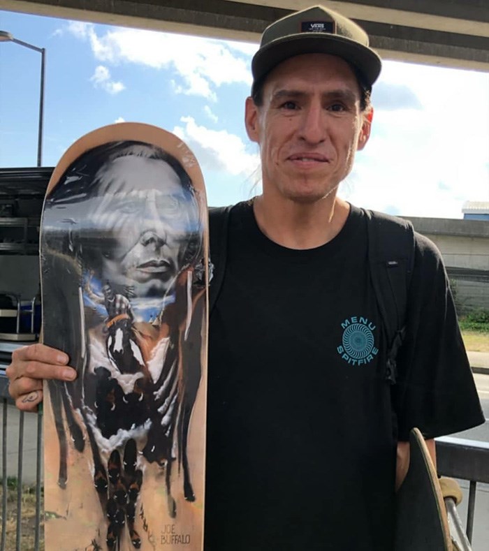  Professional skateboarder Joe Buffalo holds his first pro model for Colonialism Skateboards. Photo provided