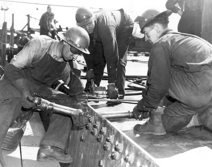  Riveters work on one of the Second World War victory ships on the North Vancouver waterfront. Photo courtesy North Vancouver Museum and Archives