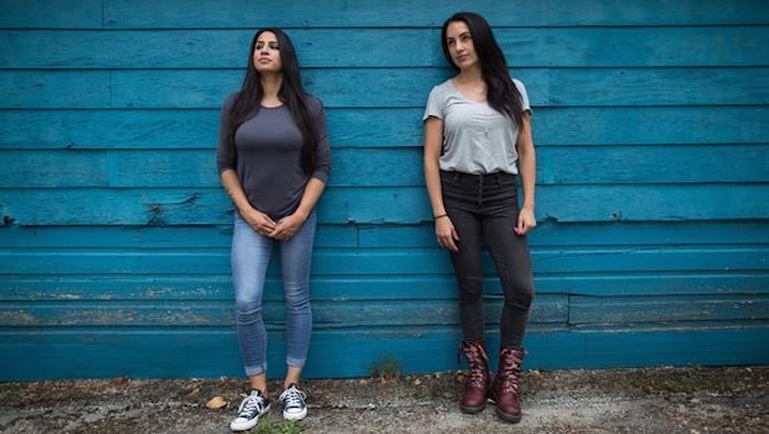  Detective Anisha Parhar, left, and Sgt. Sandy Avelar, who run a program on their own time to try and keep girls out of gangs, pose for a photograph in Vancouver, on Wednesday July 3, 2019. THE CANADIAN PRESS/Darryl Dyck
