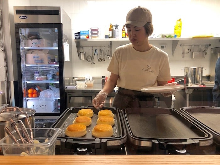  Co-owner Vicki Chen prepares to plate up a made-to-order batch of soufflé pancakes. Photo by Lindsay William-Ross/Vancouver Is Awesome