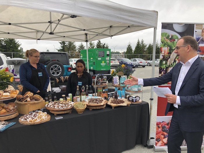  Scott Norris from YVR Airport walks media through a selection of the offerings that will be available at the marketplace at Pacific Farm Market. Photo by Lindsay William-Ross/Vancouver Is Awesome