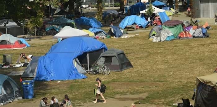  Homeless people remain in Oppenheimer Park while Mayor Kennedy Stewart calls for park board to delegate jurisdiction to the city. Photo: Dan Toulgoet