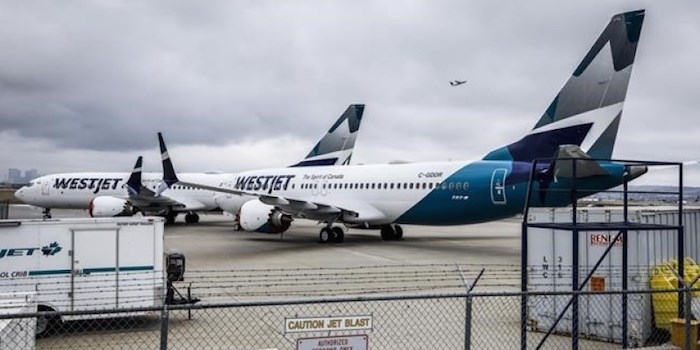  WestJet Airlines Ltd. says it is removing its grounded Boeing 737 Max jets from service until at least Jan. 5, affecting thousands of passengers with travel plans during the busy winter holiday season. Grounded WestJet Boeing 737 Max aircraft are shown at the airline's facilities in Calgary, Tuesday, May 7, 2019. THE CANADIAN PRESS/Jeff McIntosh