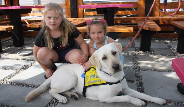  Jules, left, and Gabi, with a PADS dog. Gabi & Jules is holding a fundraiser event in Port Moody on Sun. Sept. 8, 2019. Photo courtesy Gabi & Jules