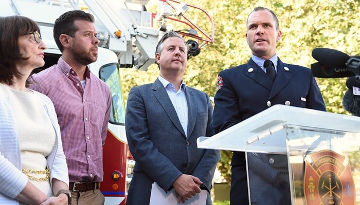  Capt. Jonathan Gormick of the Vancouver Fire Rescue Services (far right) is working with Vancouver Coastal Health to connect overdose victims to health care and support services. Also pictured is Dr. Patricia Daly, Chris Dickinson of Vancouver Coastal Health and Mayor Kennedy Stewart. Photo Dan Toulgoet