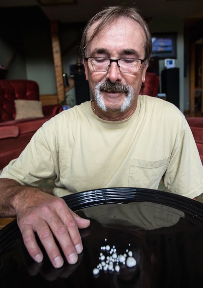  Eric Bourquin shows the pearls he found inside an oyster. Photo by Darren Stone/Times Colonist