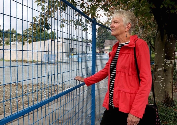  Helen Daniels visits the spot on Clarke Street where her Gallery Bistro was located until it was destroyed in a fire July 28. Daniels and her husband, Rainer, are soliciting ideas for rebuilding the property. Photo by Mario Bartel/Tri-City News