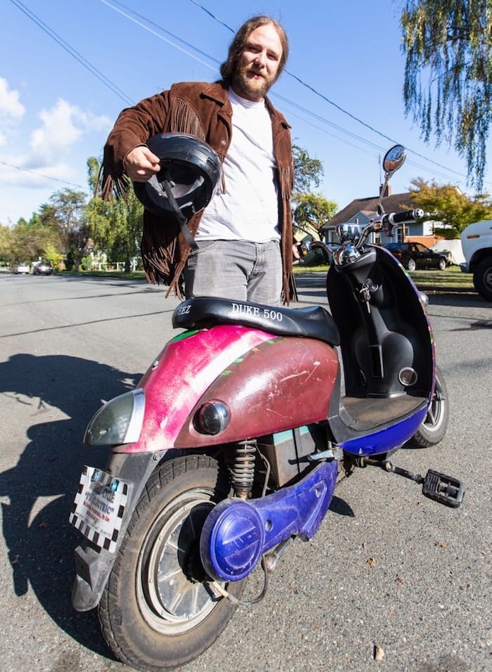  Evan Laine was ticketed by police for riding his electric scooter without insurance. Photo by Darren Stone/Times Colonist