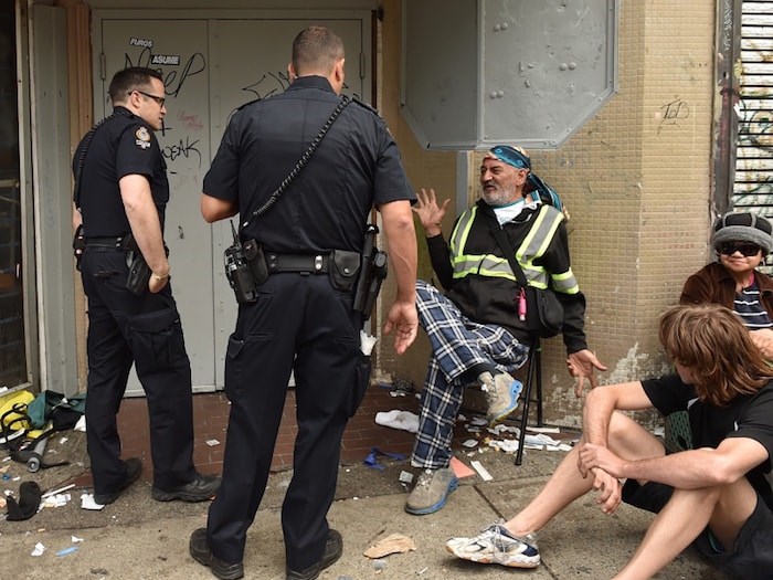  Vancouver police, seen here during the closure of the Balmoral Hotel last year, are accused of creating barriers for drug users to access overdose prevention sites in the Downtown Eastside. Photo by Dan Toulgoet/Vancouver Courier