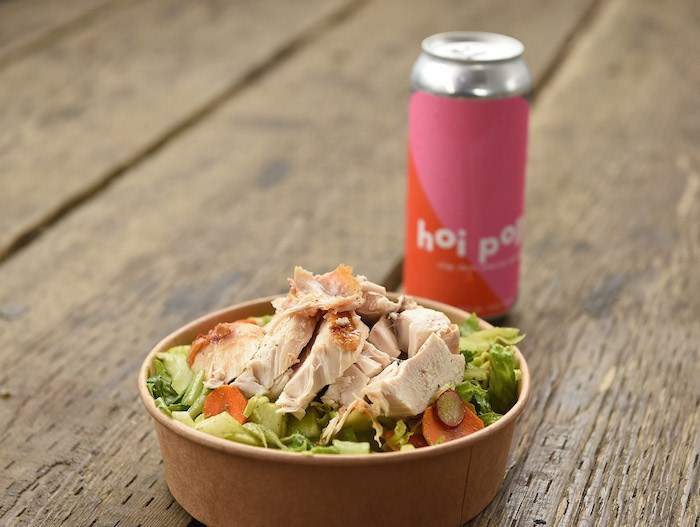  Robert Belcham of Popina's beercan chicken and salad with a Hoi Polloi beer. Photo by Dan Toulgoet