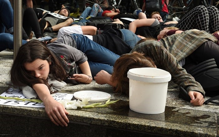  Sustainabiliteens Vancouver held a die-in for action against climate change Friday downtown at different locations, including Teck Resources Ltd., marched to the Vancouver Art Gallery to end their day of protest. Photo Dan Toulgoet