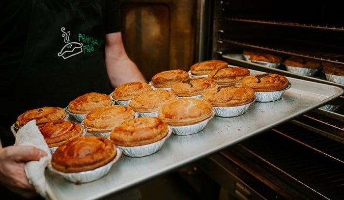  Savoury Aussie meat pies fresh out of the oven. Photo: Peaked Pies