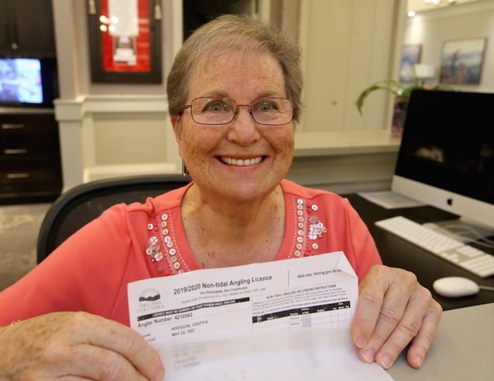  Judith Hodgson holds her fishing licence. Photo by Adrian Lam/Times Colonist