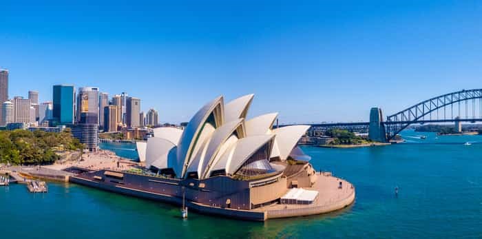  Photo: Amazing aerial footage view of the Sydney city from above with Harbour bridge, Opera house ant the harbour. April 10, 2016. Sydney, Australia