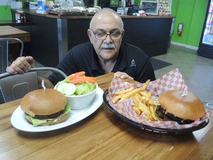  Zia Arfaee is very proud of his home-made burgers, which are made fresh every Monday and Thursday only. Photo by Alan Campbell/Richmond News