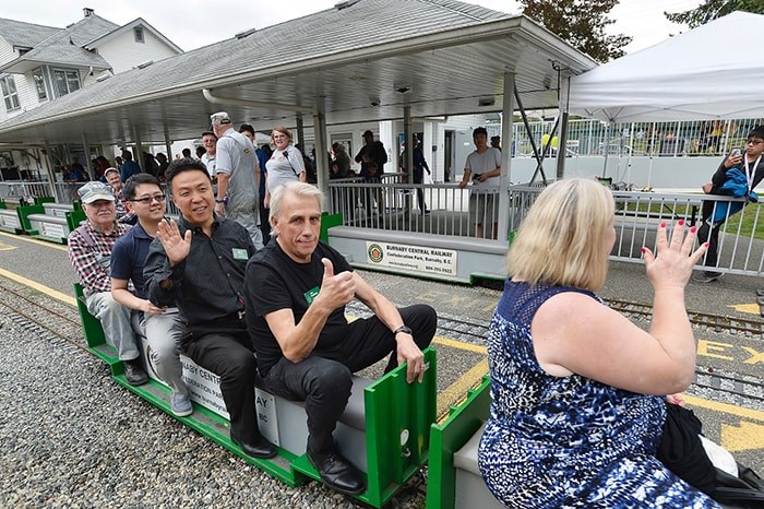  Coun. Joe Keithley rides the Burnaby Central Railway with Coun. James Wang