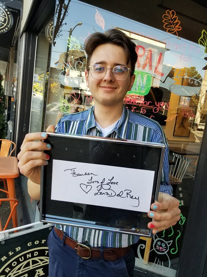  Brenden Dixon with his framed Lana Del Rey signature. Photo: Elisia Seeber