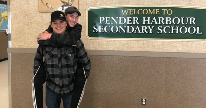  Jakob Thornton (front) and Nolan Johnston at Pender Harbour Secondary School the day after they discovered a 90-year-old man trapped in his car on a remote road in the area.